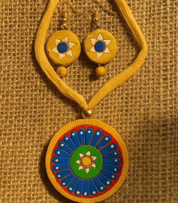 yellow rangoli chakra clay jewellery